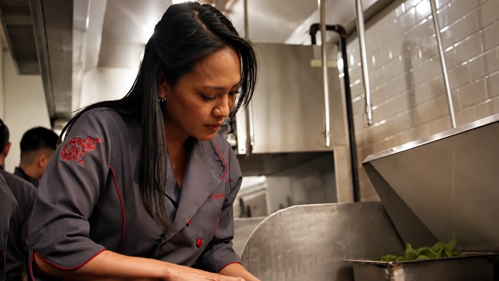 Chef DeeDee Niyomkul working in the kitchen