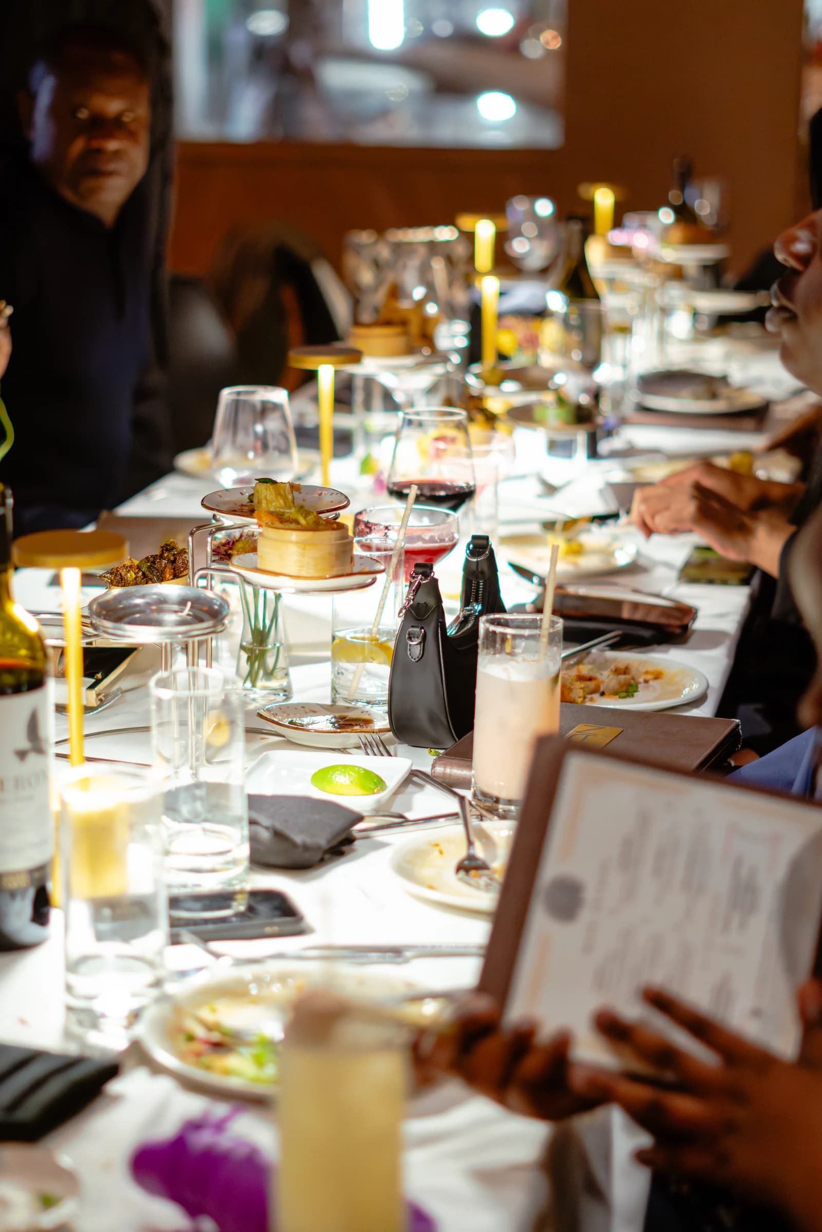 Guests around a long table during a celebration dinner at Nan Thai Buckhead