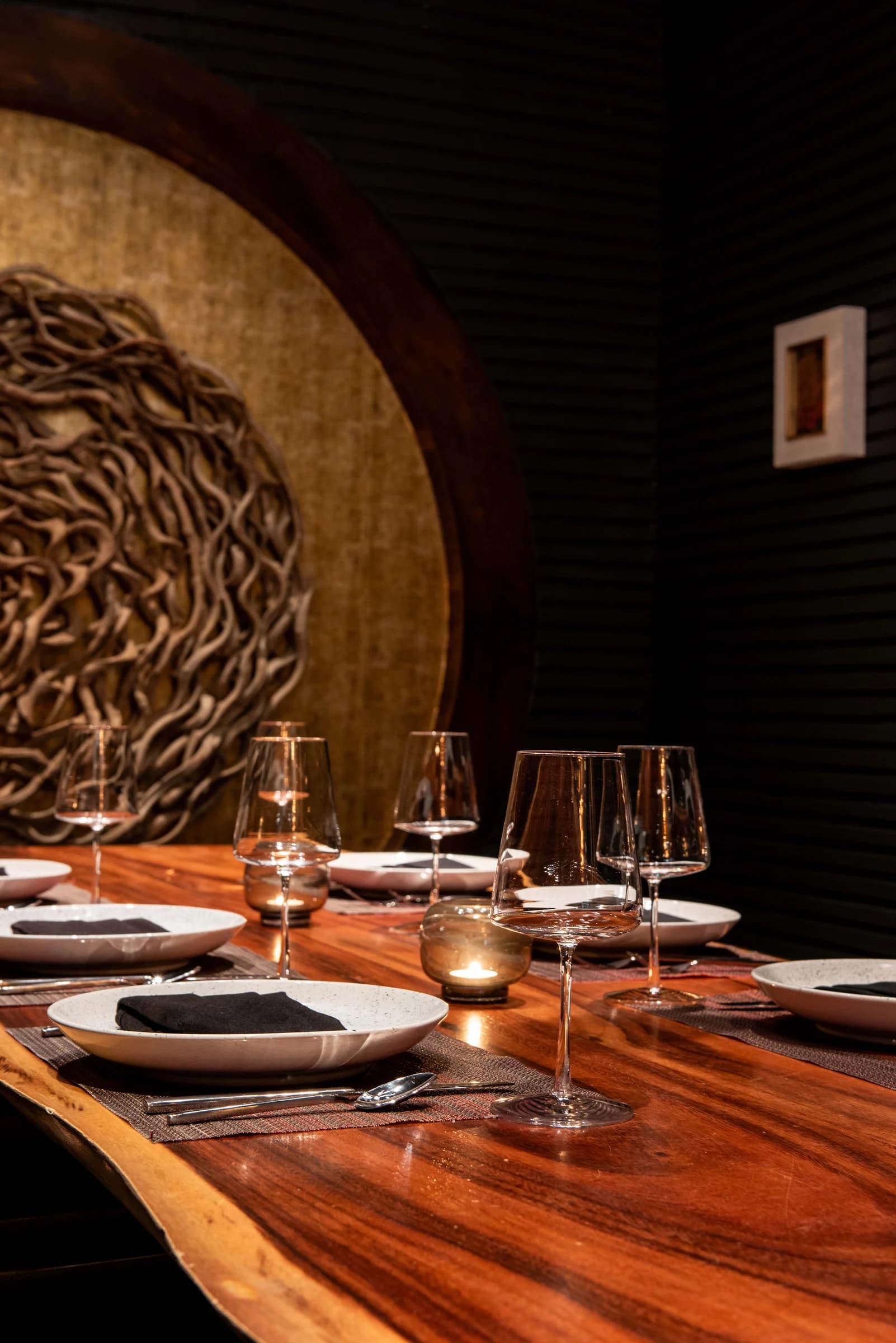 Charlie's Room dining table beneath a sculptural light